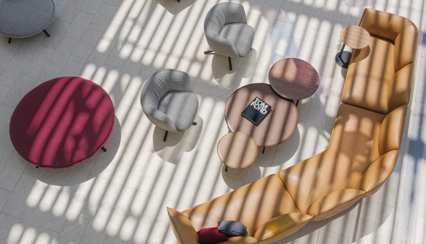 LucaSofa_Collage_01 a living room with a large round rug and chairs